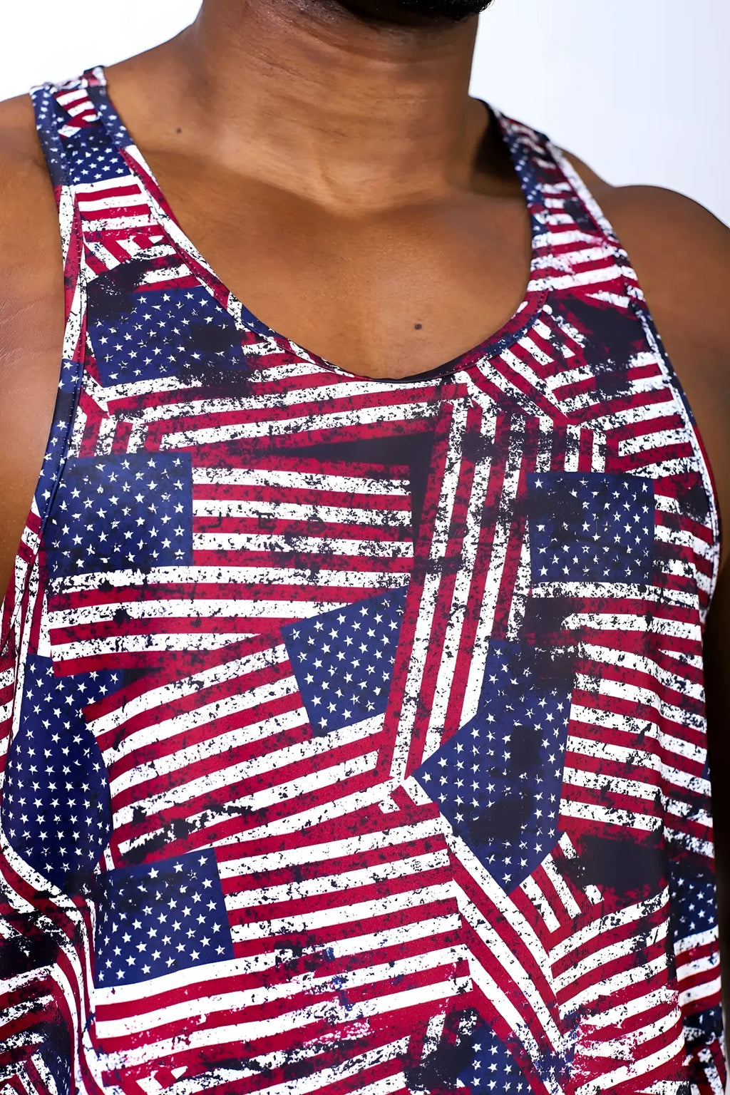 Graphic muscle stringer tank top with vibrant distressed USA flag pattern in red white and blue for casual wear