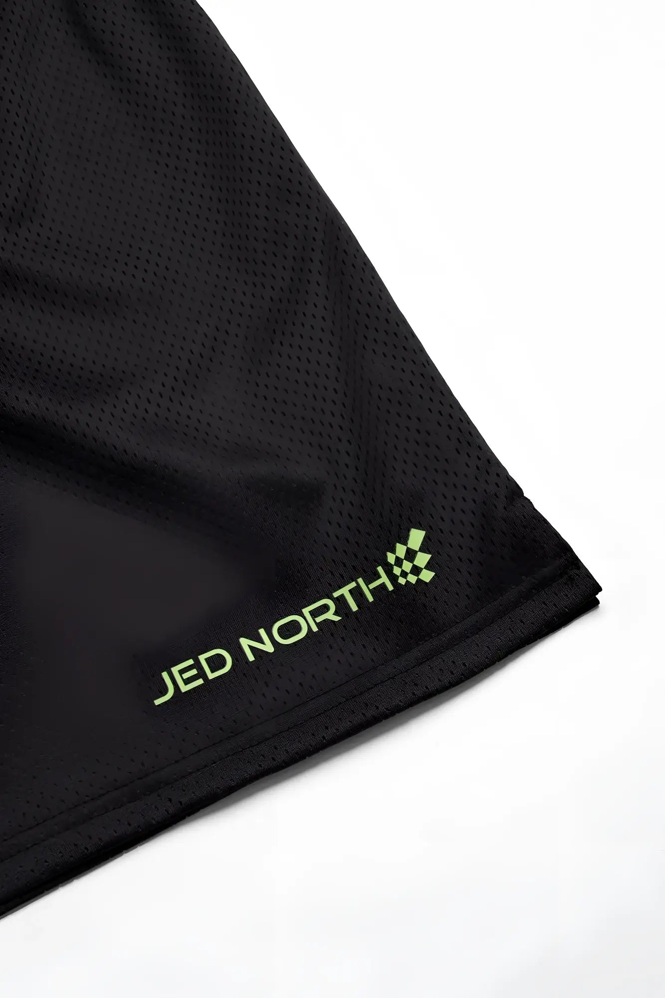 Black mesh jed north jersey mesh 7.5 inch gym shorts with neon green branding and logo for athletic use