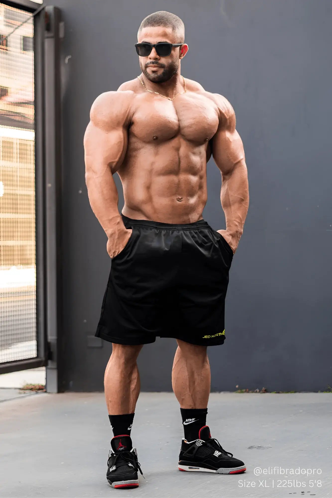 Black jed north jersey mesh 7.5 inch gym shorts with subtle neon green logo on lower right leg for athletic use
