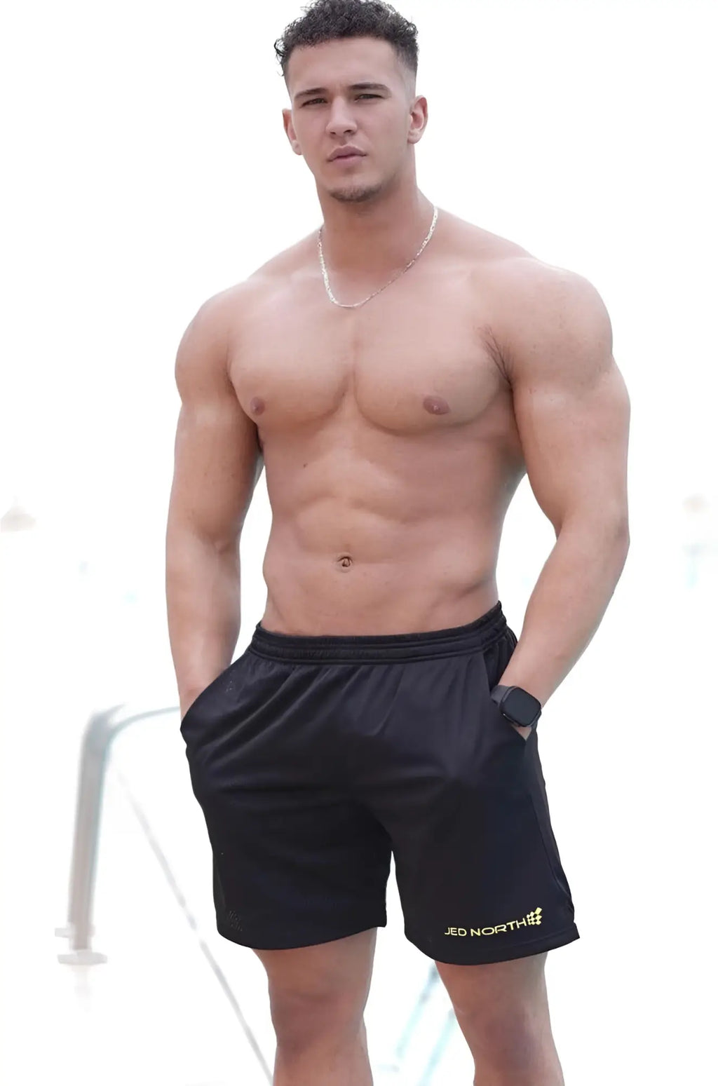 Jed North jersey mesh 7.5 inch gym shorts in black with subtle textured fabric and small gold jed north logo on front