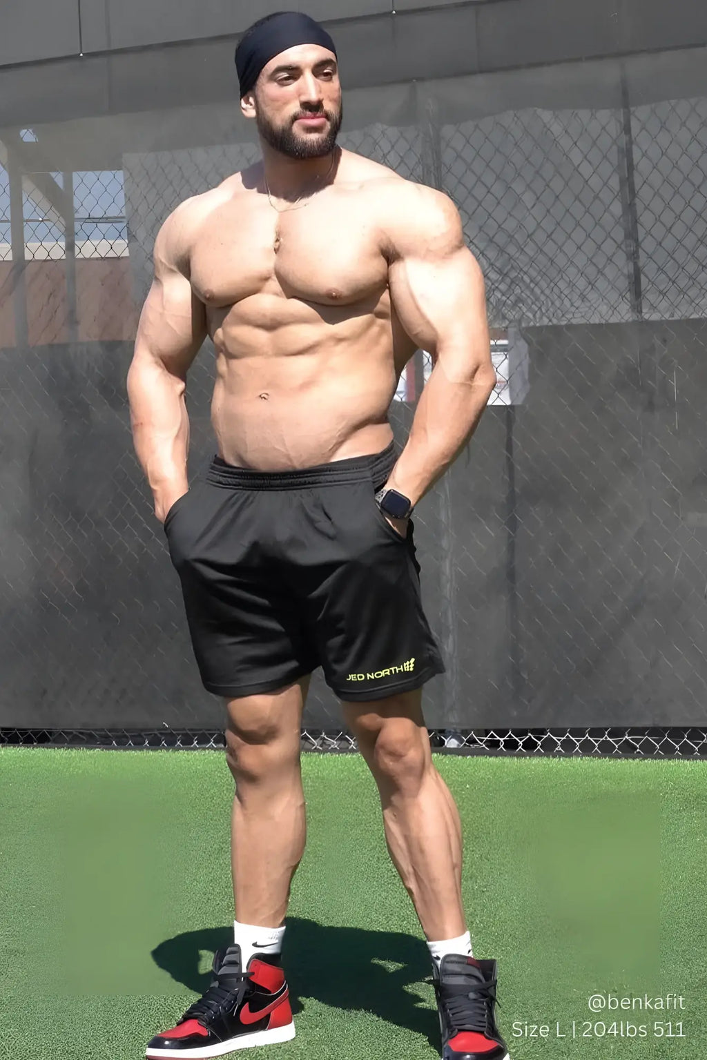 Jed North Jersey Mesh 7.5 inch black gym shorts with subtle yellow logo on lower right leg made of breathable mesh