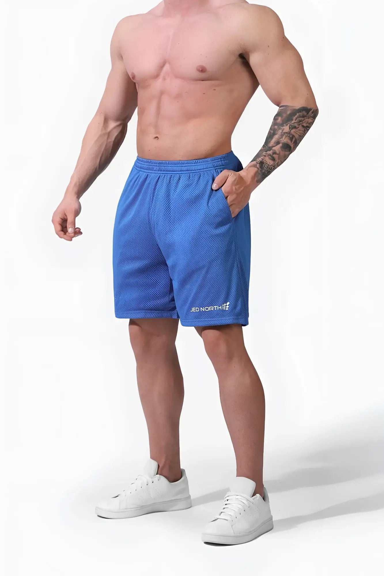 Blue jed north jersey mesh 7.5 gym shorts with white logo on lower left leg made of breathable mesh material