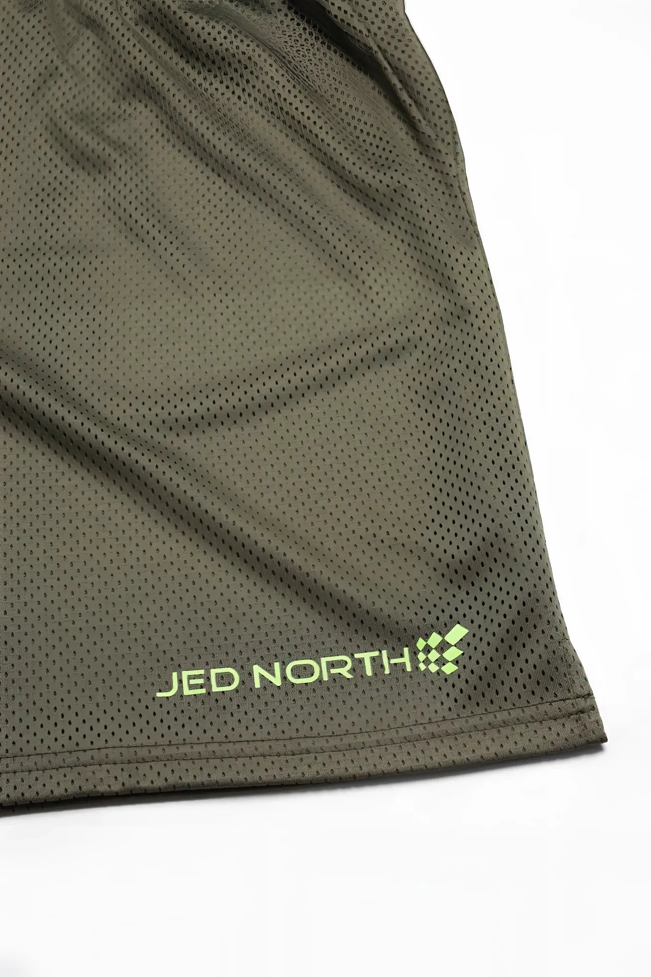Olive green jed north jersey mesh 7.5 inch gym shorts with neon yellow logo stitched near the hem