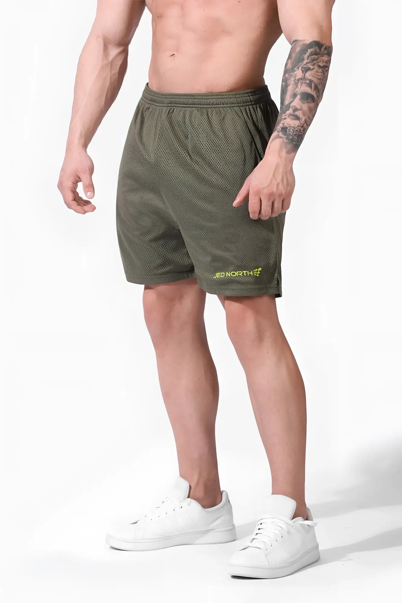 Jed North jersey mesh olive green athletic shorts with 7.5 inch inseam and subtle yellow logo on lower left leg