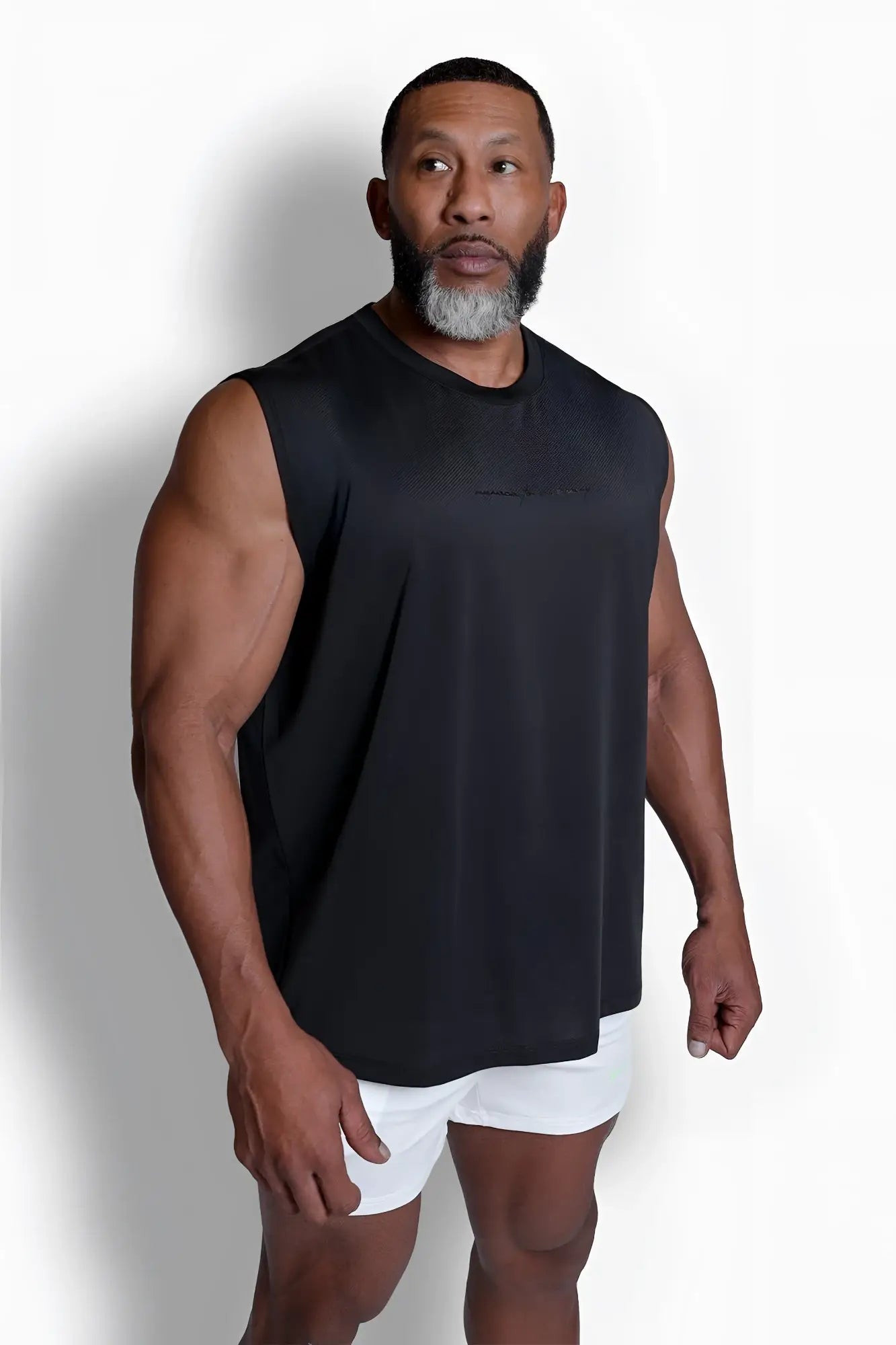 Black sleeveless athletic top jn active muscle tee black with a minimalist design for activewear use