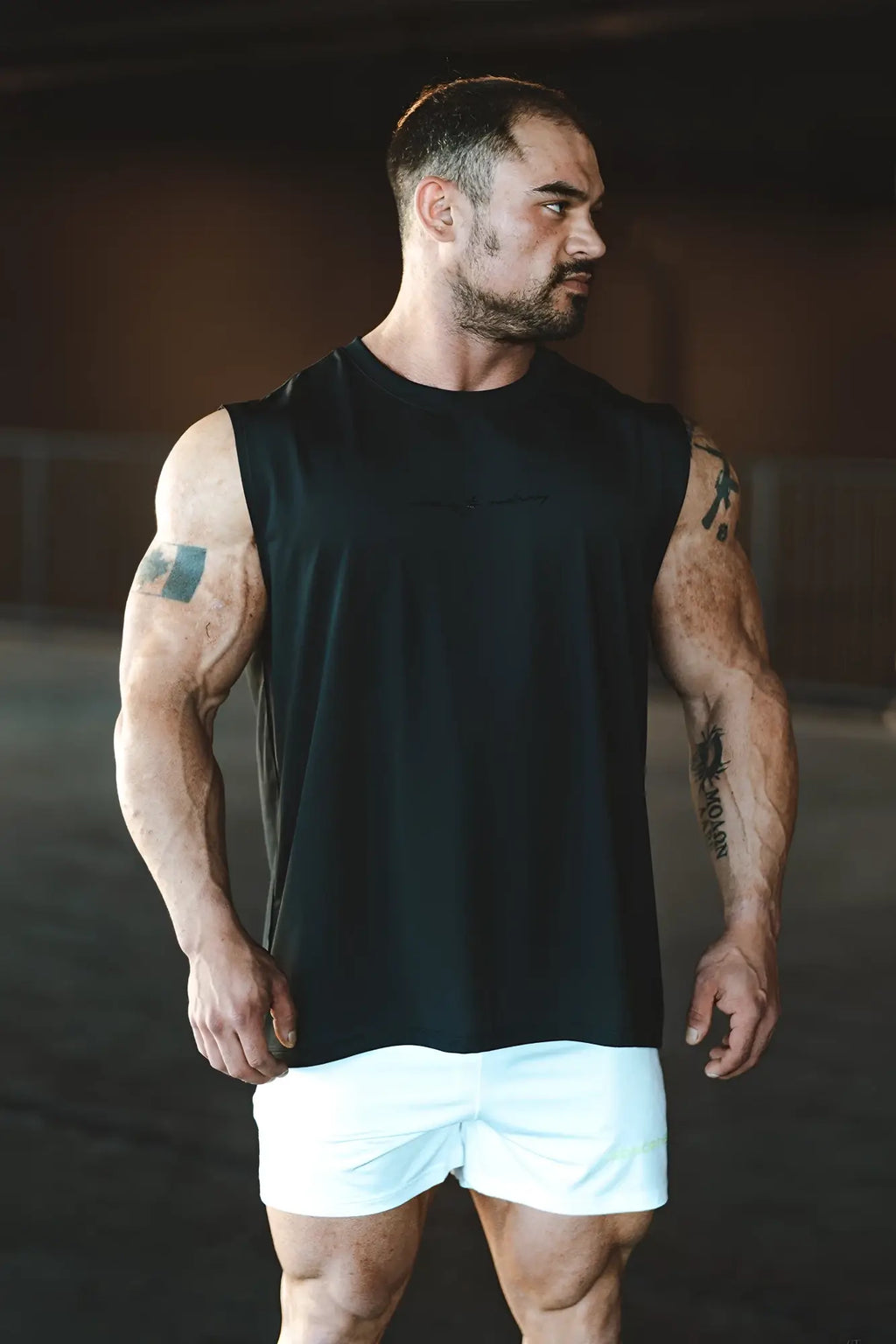 Black sleeveless athletic tank top jn active muscle tee with relaxed fit for workout and casual wear