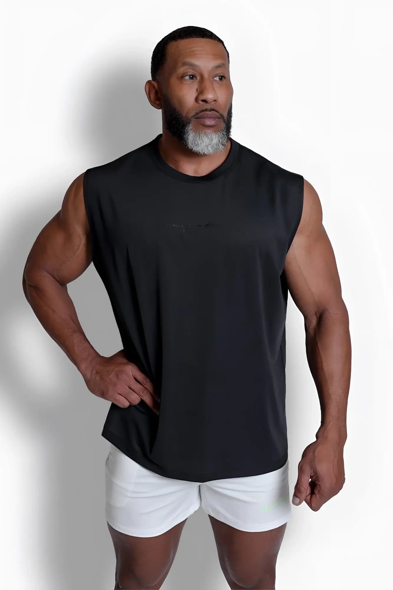 Black sleeveless jn active muscle tee with subtle chest logo designed for athletic performance and comfort