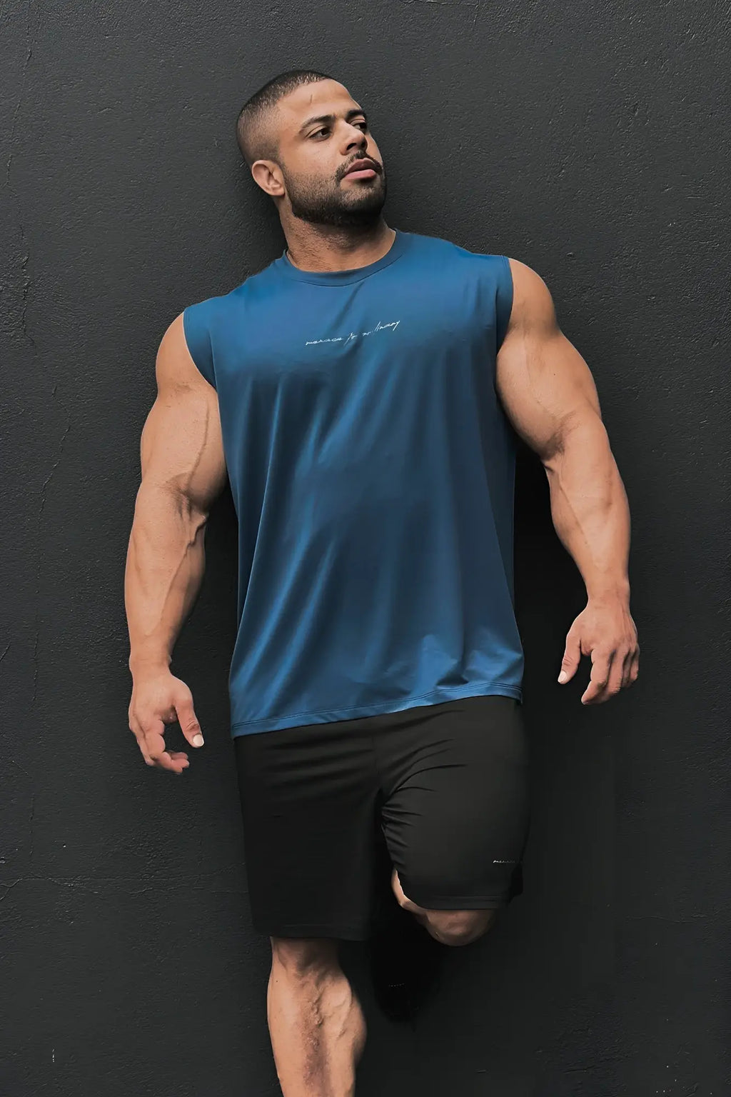 Jn active muscle tee navy blue sleeveless athletic top with subtle white script detailing across the chest