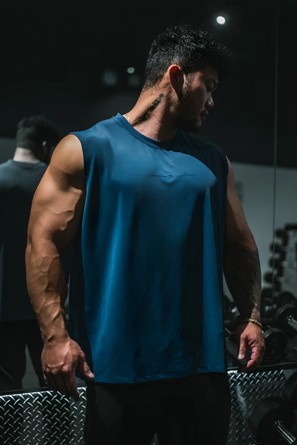 Jn Active Muscle Tee navy blue sleeveless athletic tank top with subtle embroidered logo across the chest
