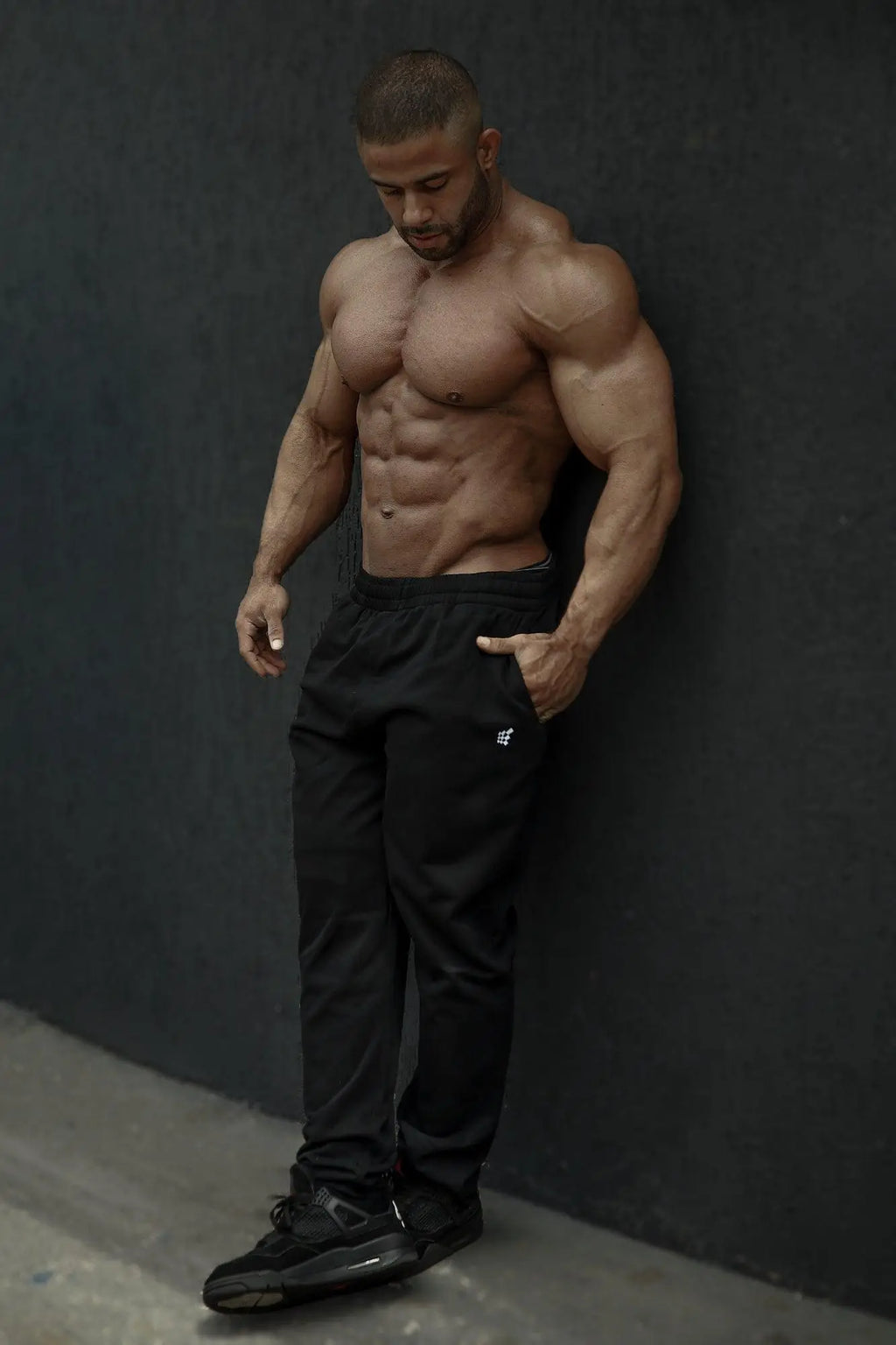 Jed north lax straight cut joggers in black feature a subtle white logo on the left thigh for athletic wear