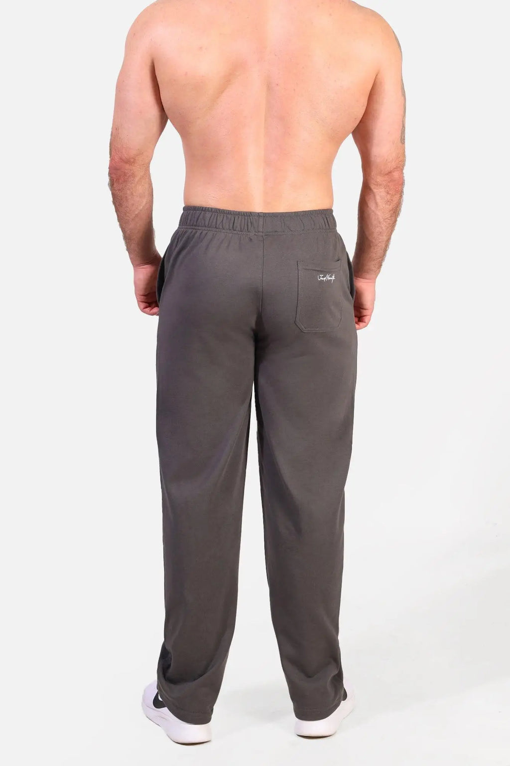 Back view of gray jed north lax straight cut athletic joggers with elastic waistband and branded patch on pocket