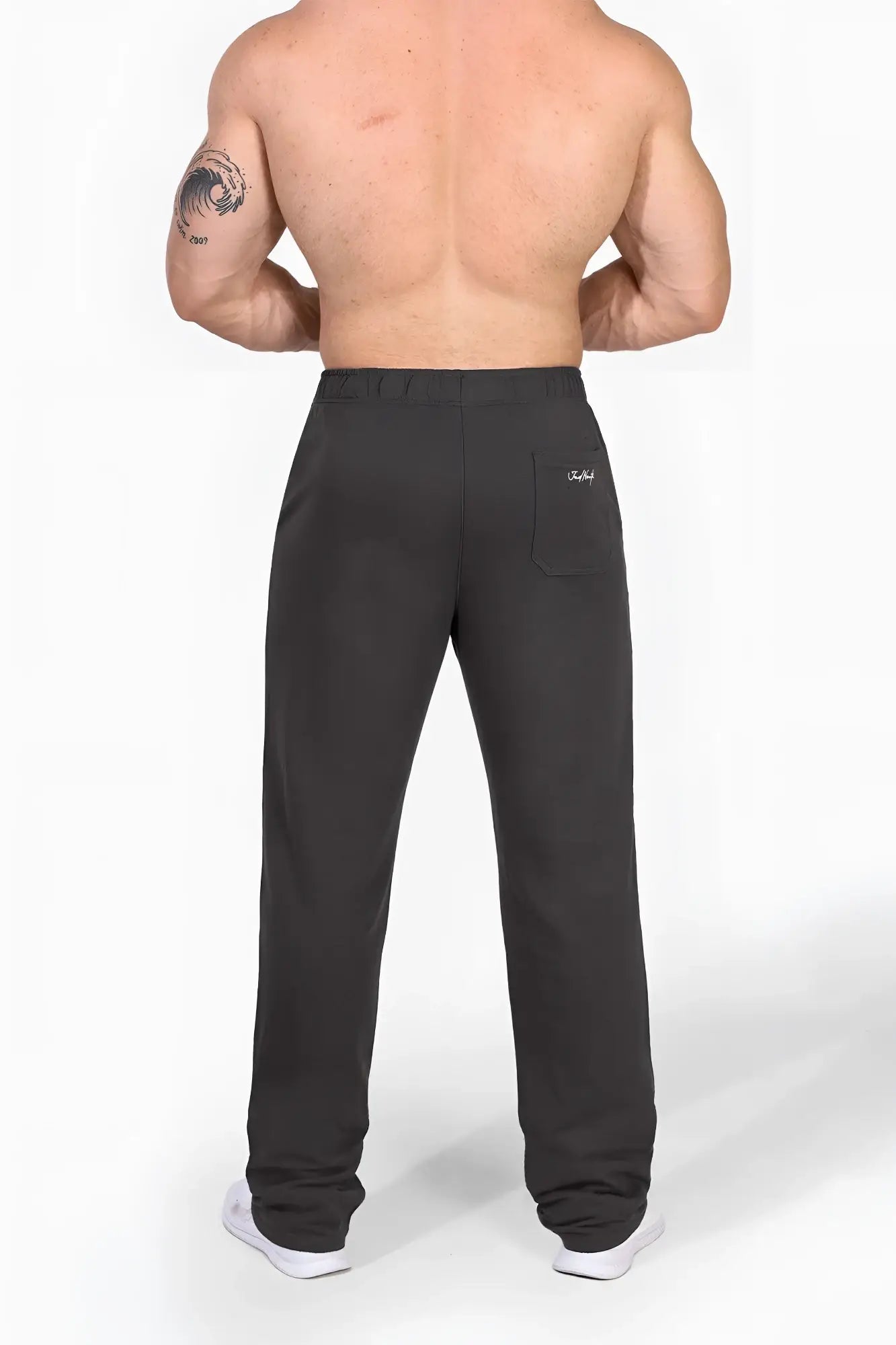 Back side of dark gray jed north lax straight cut joggers showing subtle brand logo on the back pocket