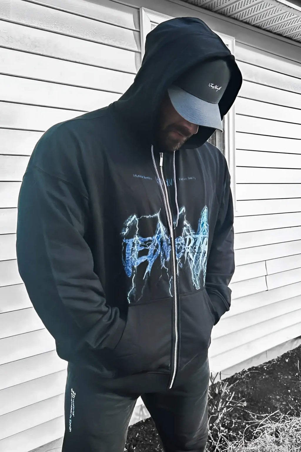 Limited edition black zip-up hoodie made of soft fabric with a blue lightning bolt graphic on the front