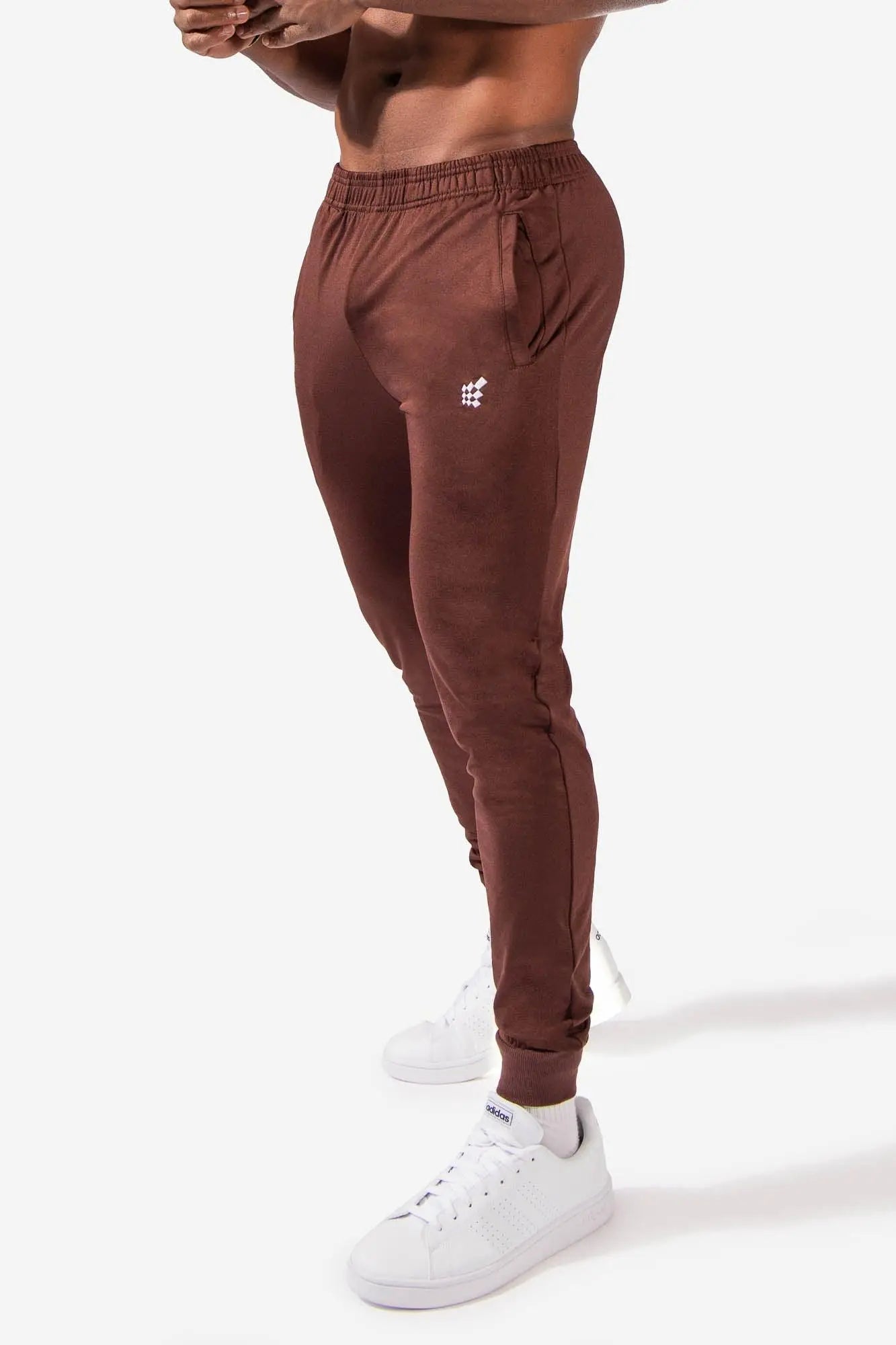 Jed north matrix tapered joggers in brown with elastic cuffs and a subtle white logo on the thigh