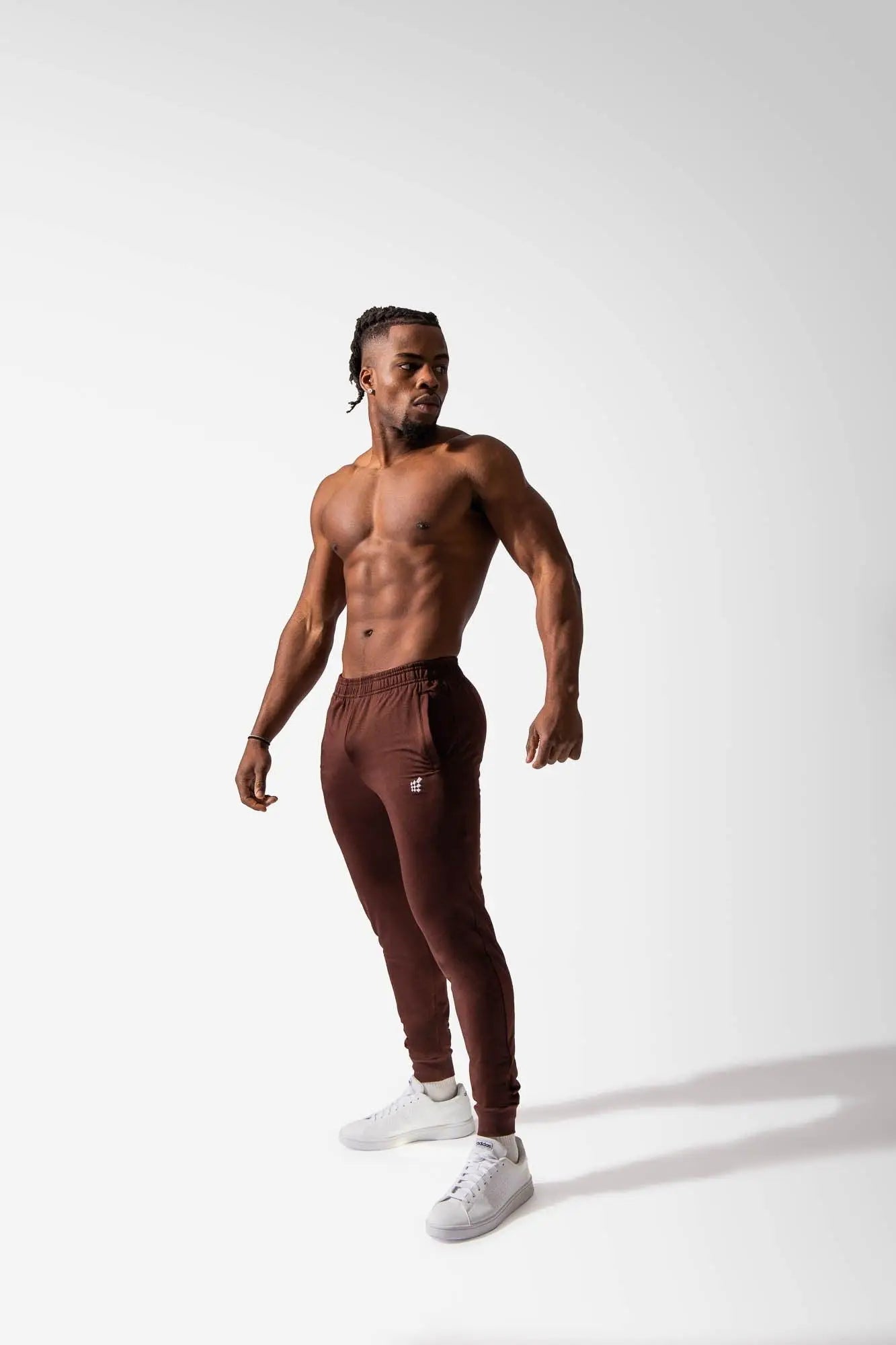A pair of maroon jed north matrix tapered joggers with a small logo on the left thigh designed for athletic use