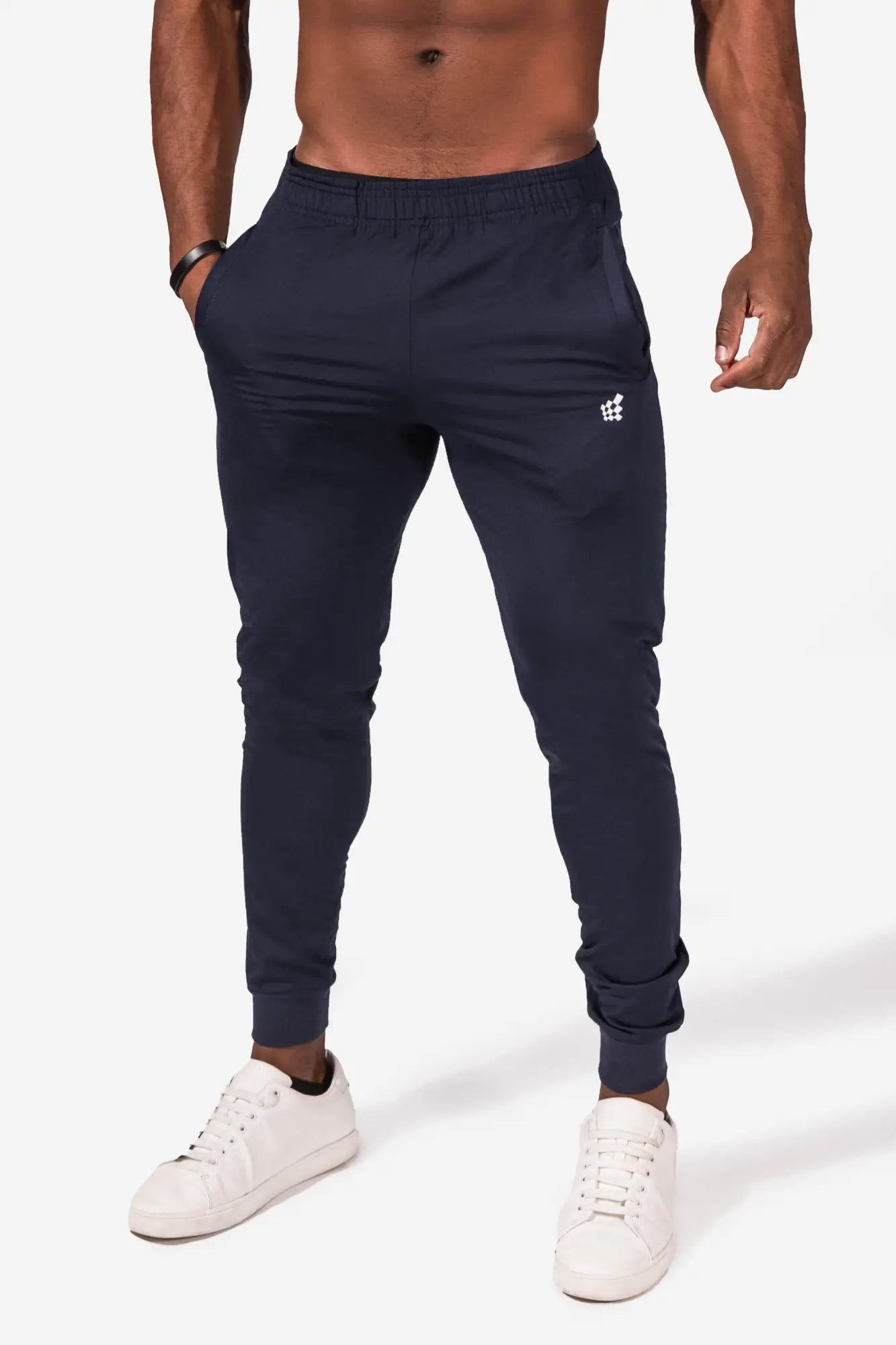 Navy jed north matrix tapered joggers with elastic cuffs and subtle white logo on thigh for athletic use