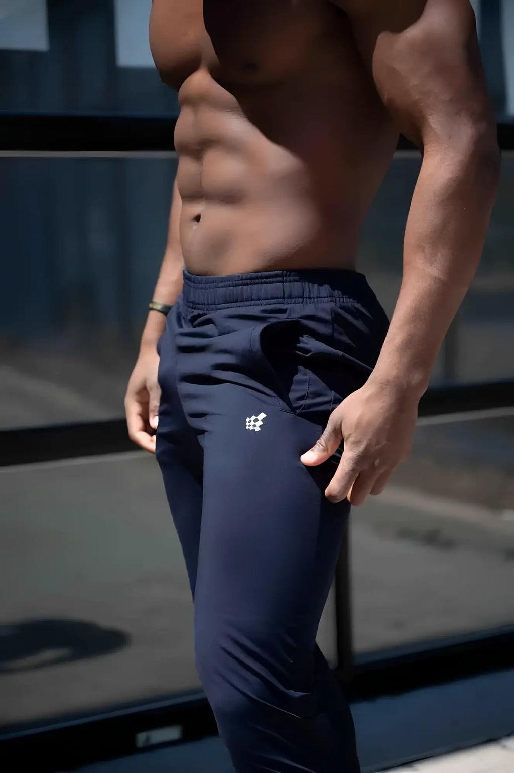 Navy blue Jed North Matrix tapered joggers with a small white logo on the left thigh for athletic use