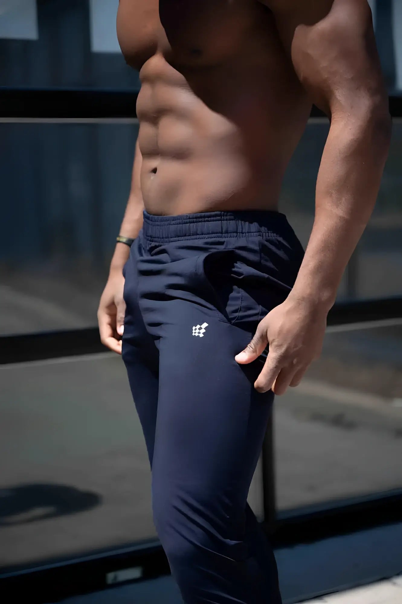 Navy blue Jed North Matrix tapered joggers with a small white logo on the left thigh for athletic use
