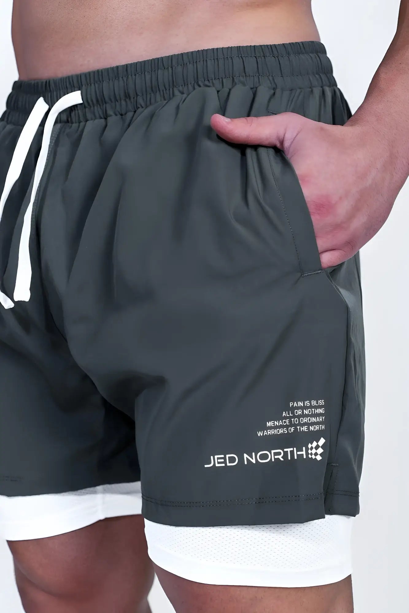 Jed North men’s 2-in-1 olive athletic shorts with white drawstrings, inner lining, and logo on lower leg