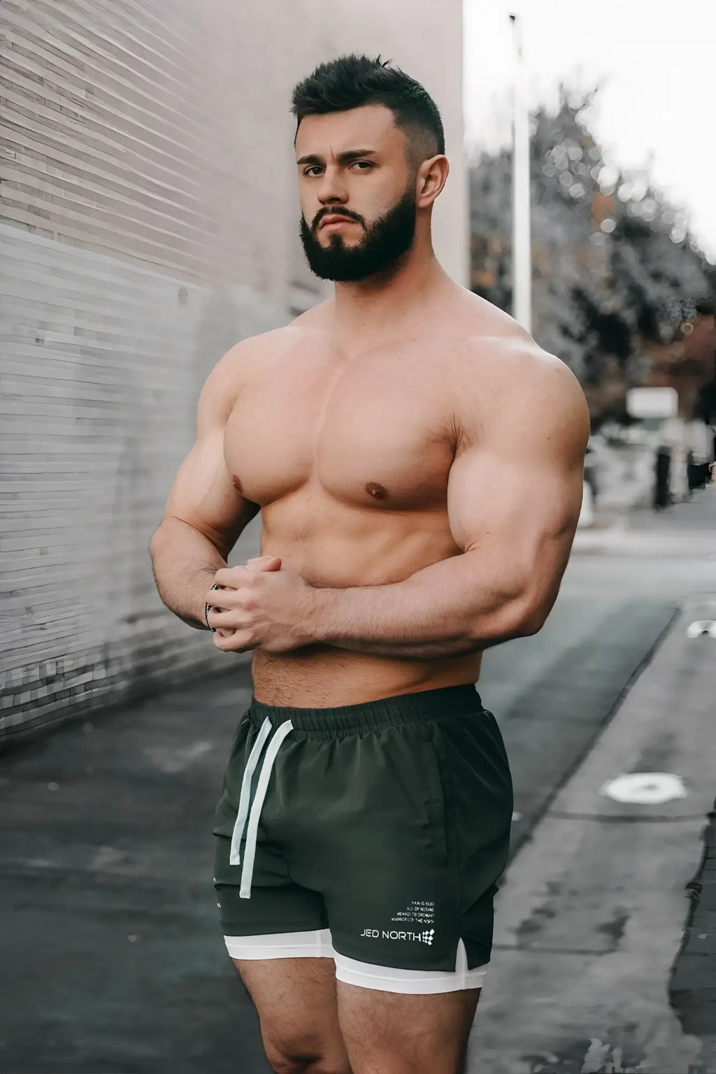 Jed North men’s 2-in-1 olive athletic shorts with white drawstrings trim and logo on the lower left leg for training