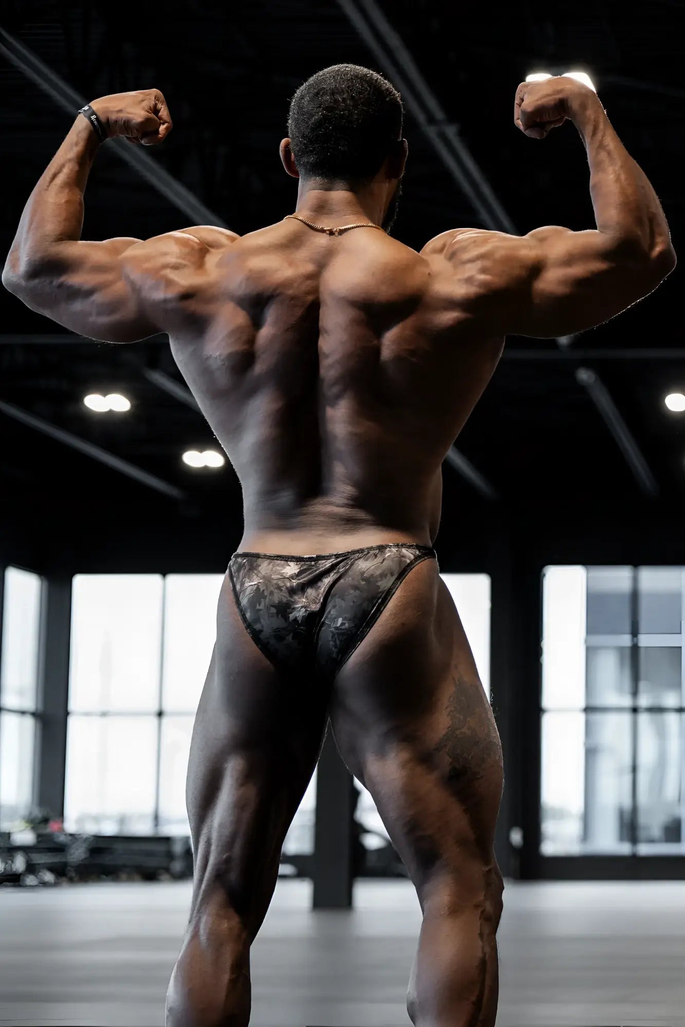Men’s bodybuilding posing trunks in black and gray camo pattern designed for athletic performance