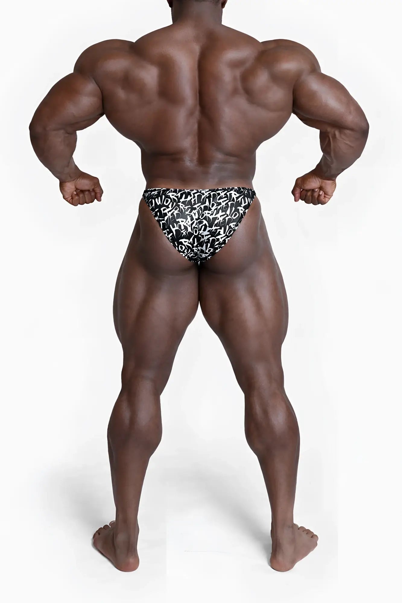 Black and white patterned men’s bodybuilding posing trunks with bold stylized lettering in chaotic design