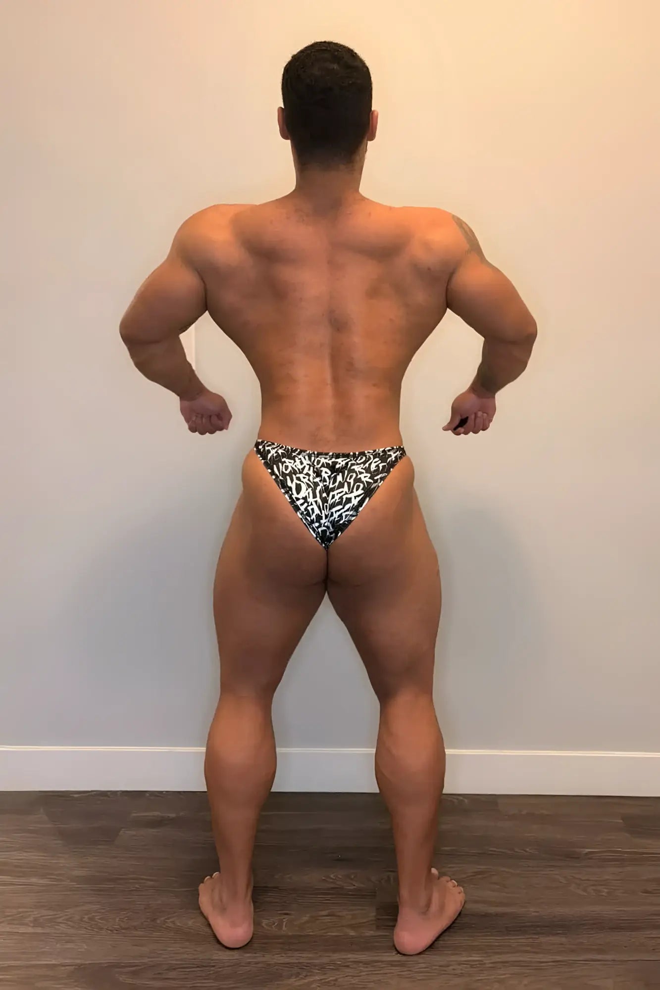 Men’s bodybuilding posing trunks chaotic with black and white bold graphic patterned briefs front view