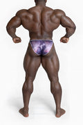 Men’s bodybuilding posing trunks with a purple and pink galaxy pattern and subtle white trim