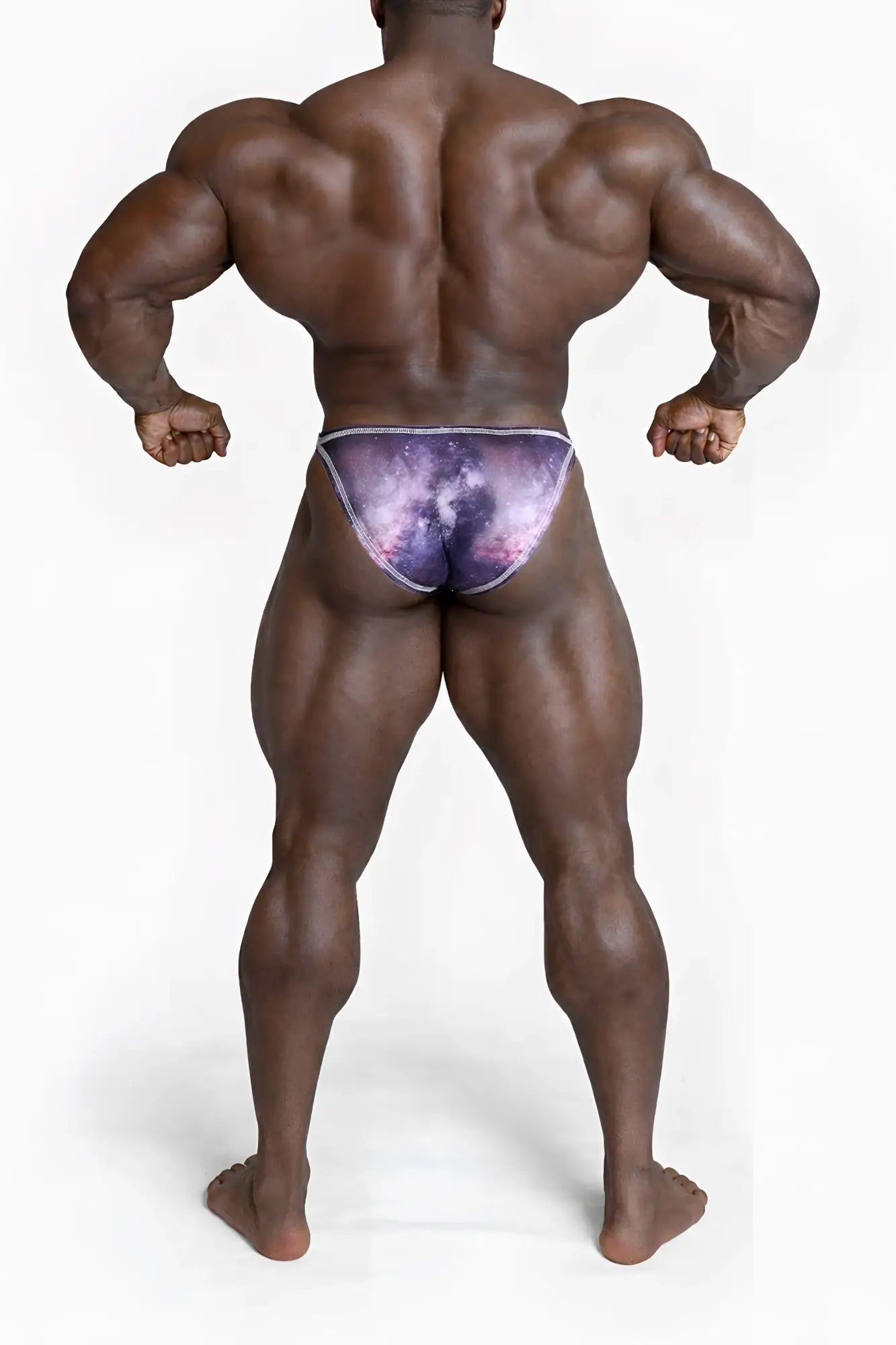 Men’s bodybuilding posing trunks with a purple and pink galaxy pattern and subtle white trim
