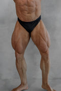 Men’s classic physique trunks black briefs with 2 inch seam worn by muscular individual front view