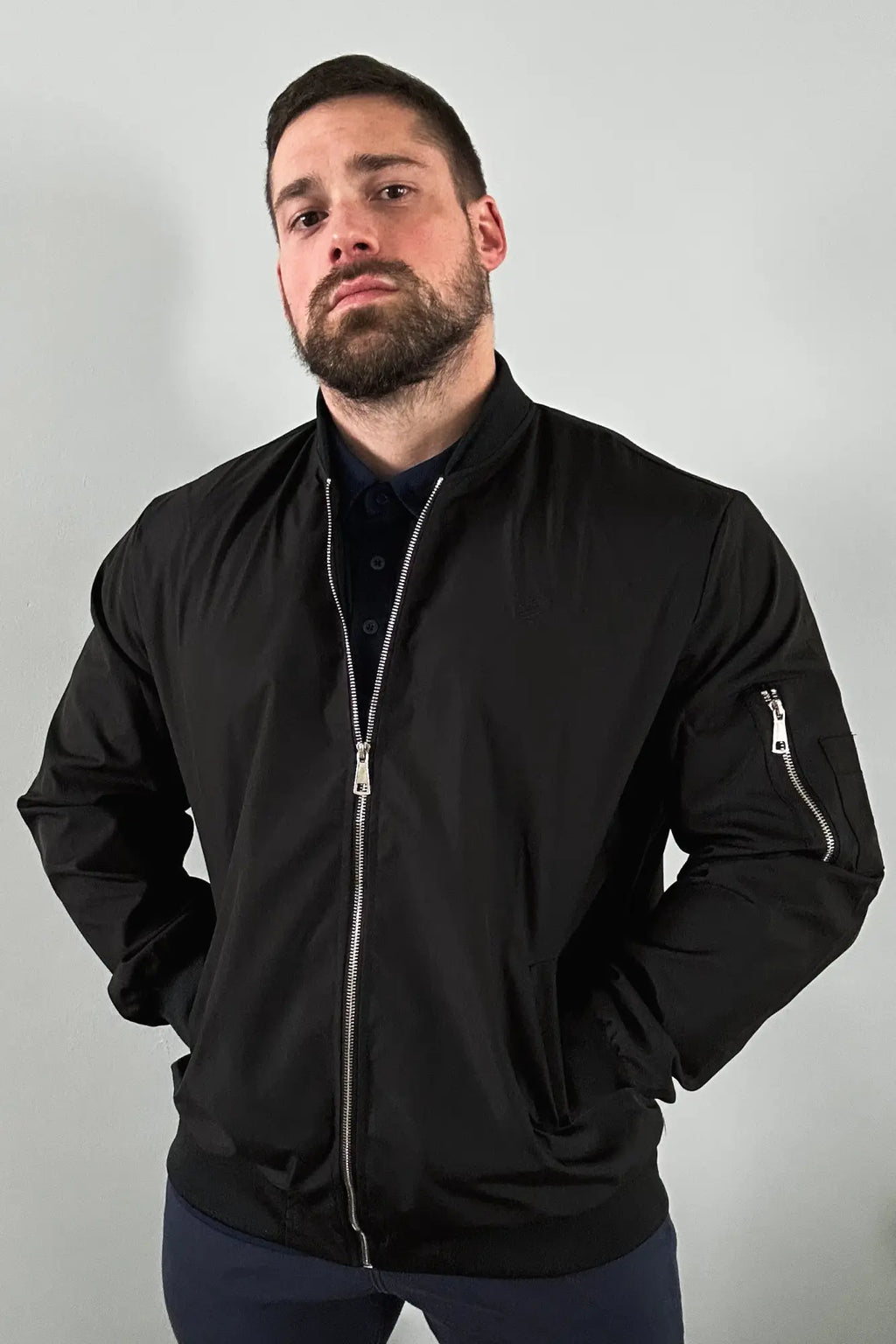 Men’s premium black bomber jacket with silver zippers and ribbed collar in durable material for stylish outerwear
