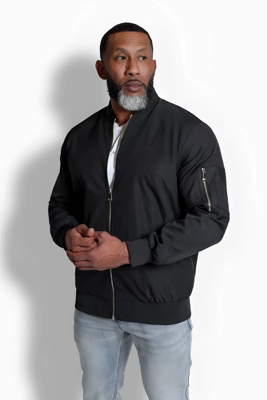 Men’s premium bomber jacket in black with sleek modern design and subtle silver zippers made from high-quality material