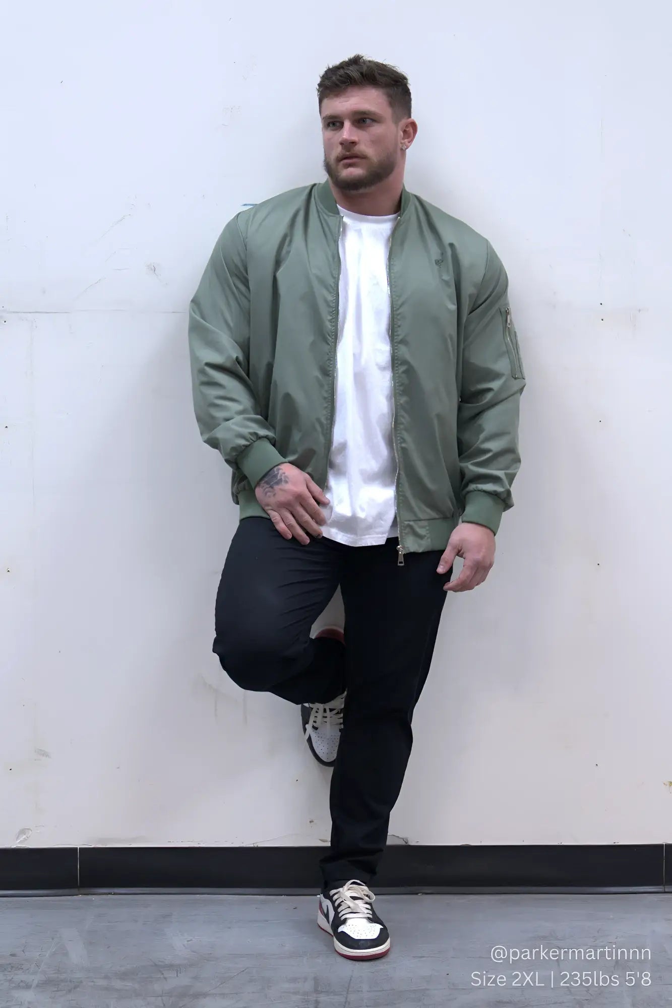 Men’s premium olive green bomber jacket made from durable material perfect for casual and outdoor wear