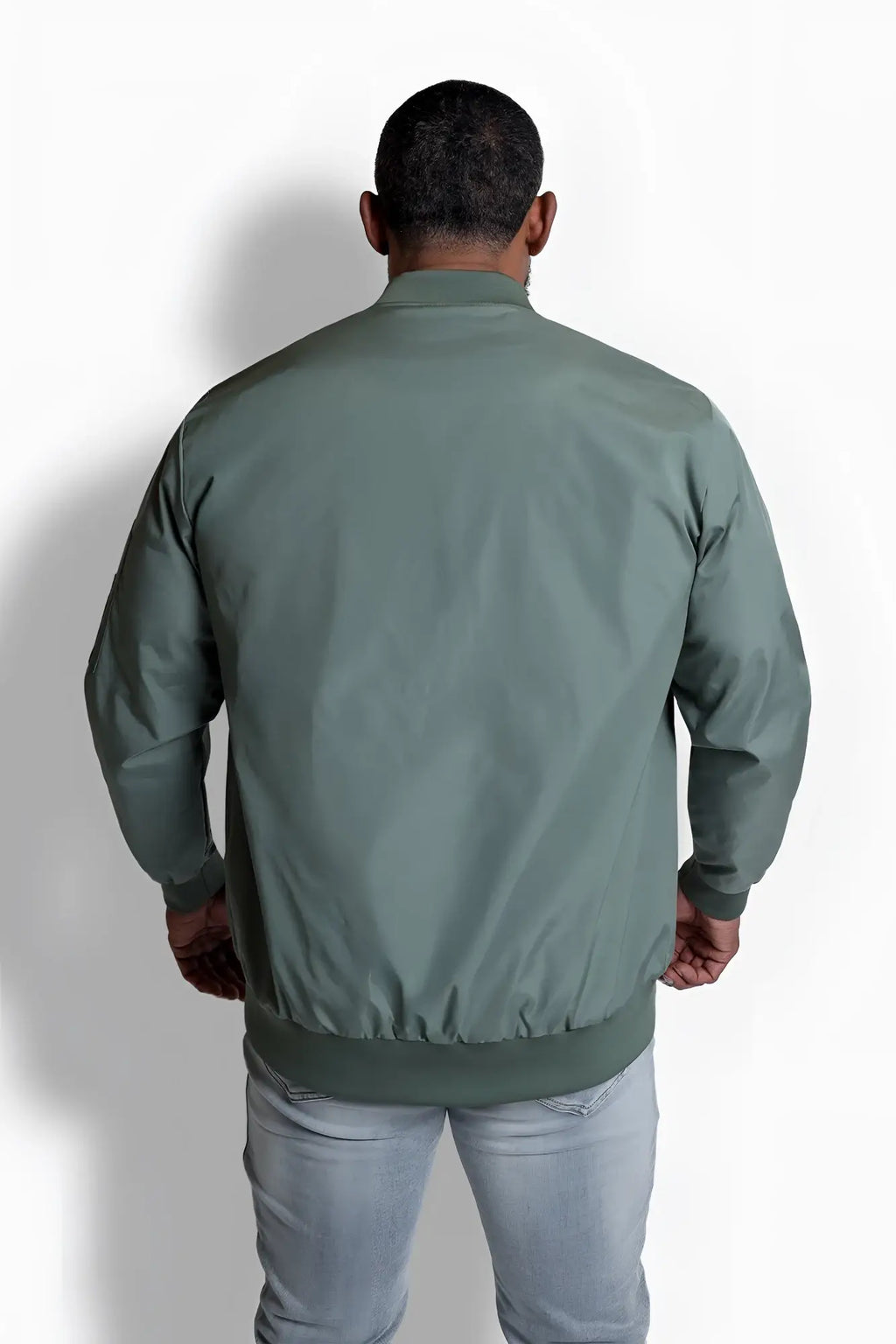 Men’s premium olive bomber jacket made of smooth slightly shiny fabric with ribbed cuffs and hem