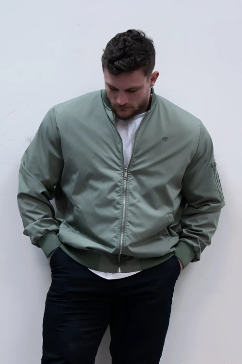 Men’s premium olive bomber jacket with subtle logo on left chest and ribbed cuffs in durable fabric