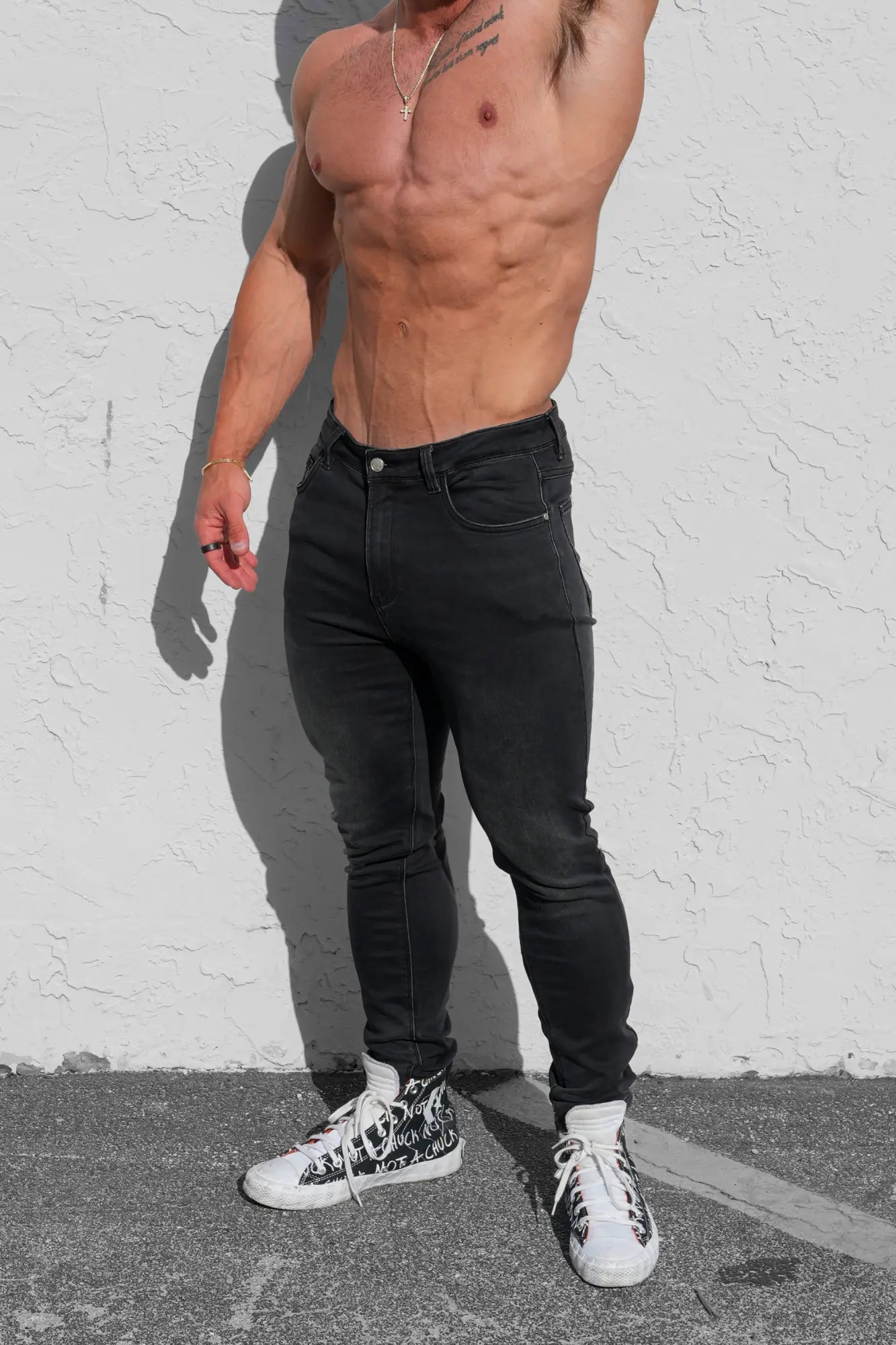 Men’s premium fitted stretchy jeans in faded black with a classic five-pocket design and subtle stitching details