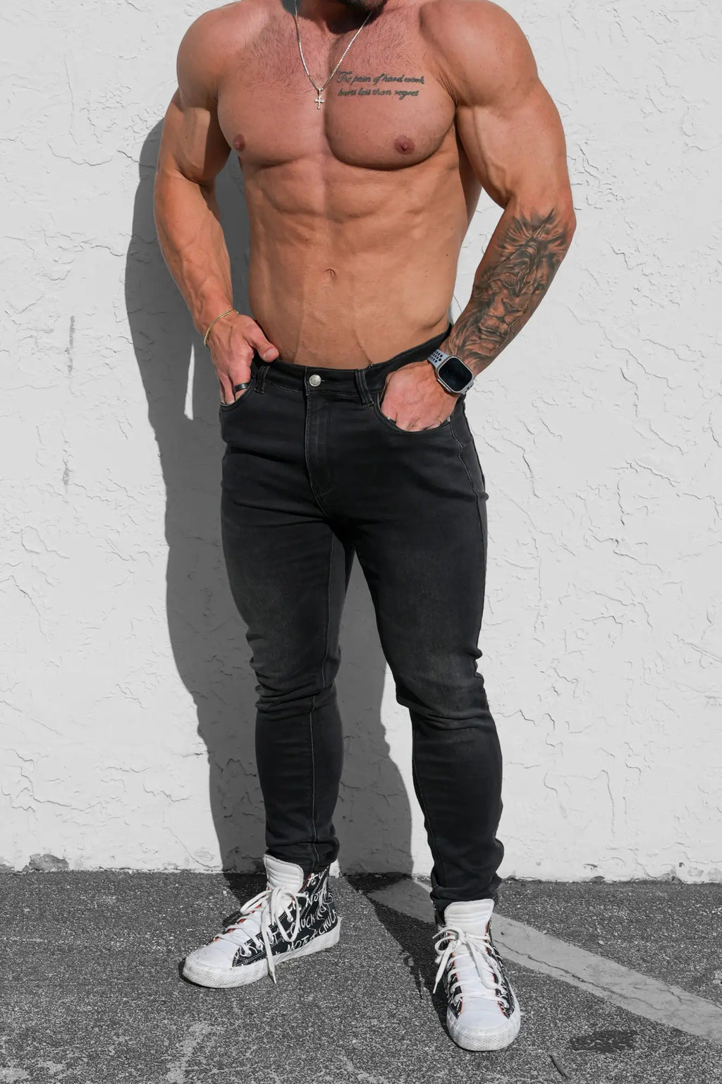 Men’s premium fitted stretchy jeans in faded black with sleek black skinny design and subtle thigh fading