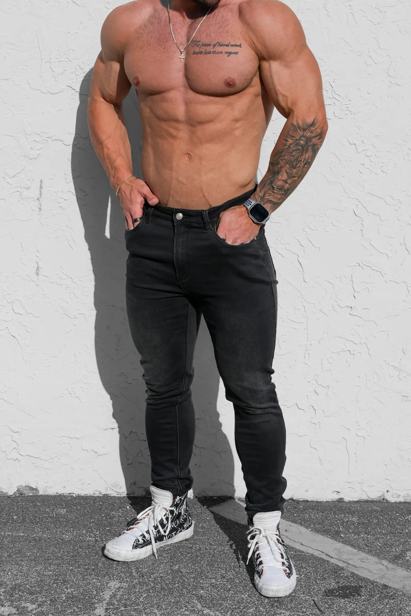 Men’s premium fitted stretchy jeans in faded black with sleek black skinny design and subtle thigh fading