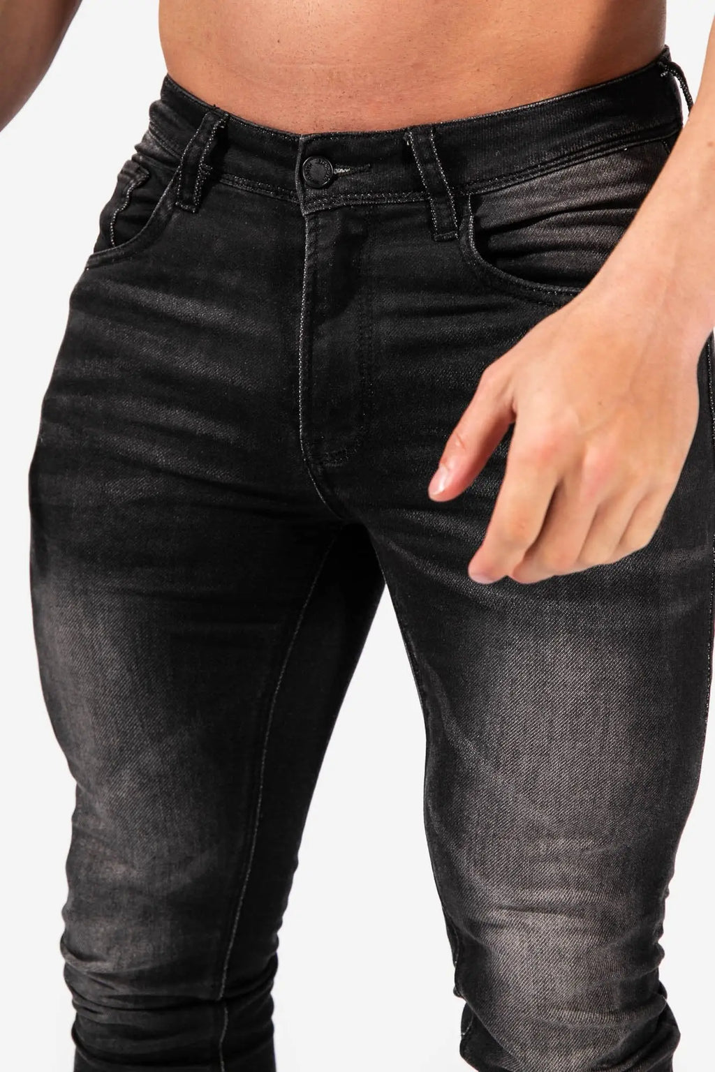 Men’s premium fitted stretchy black skinny jeans with slim fit and subtle distressed texture in faded black color