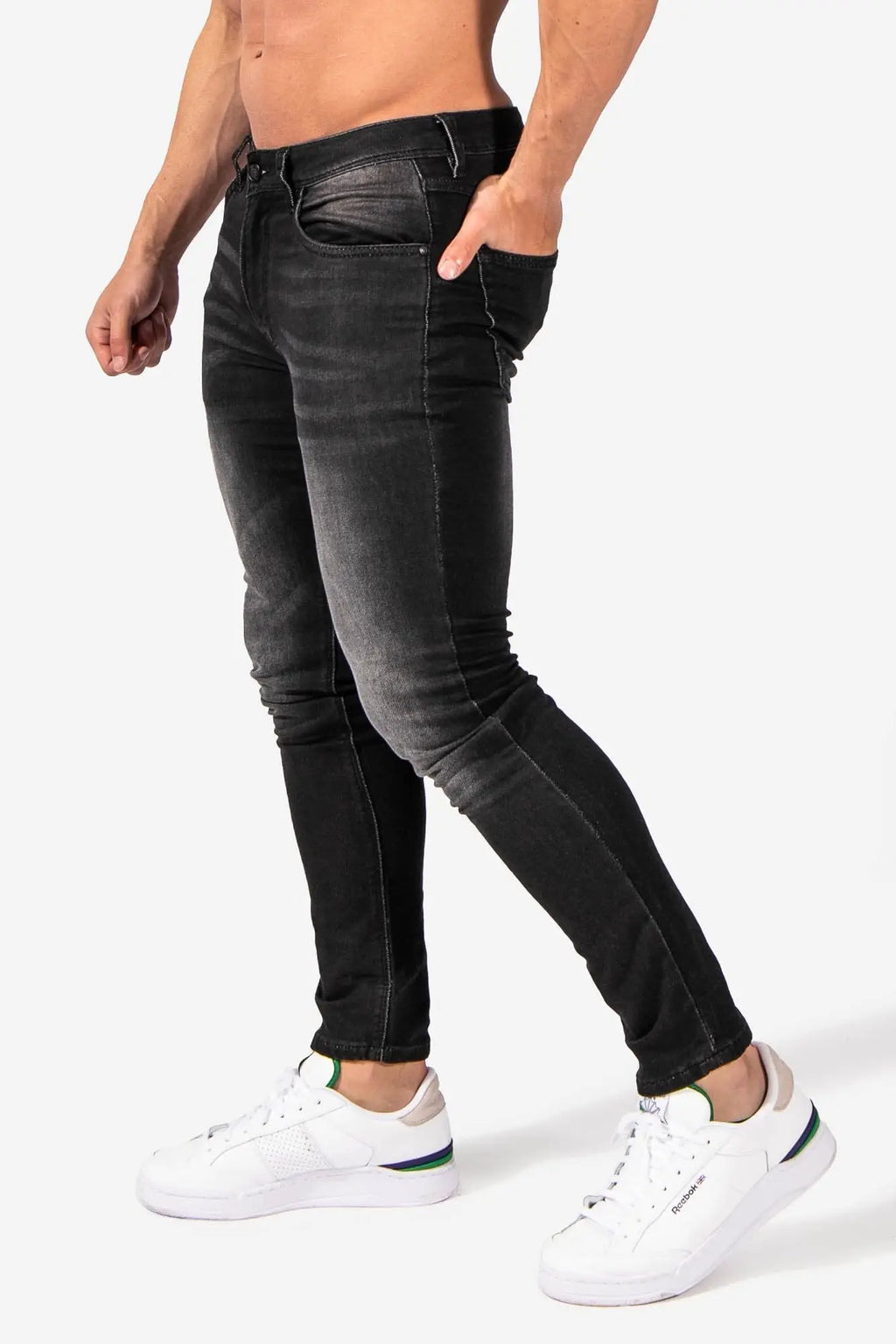 Men’s premium fitted stretchy black denim jeans with faded wash and subtle distressing details