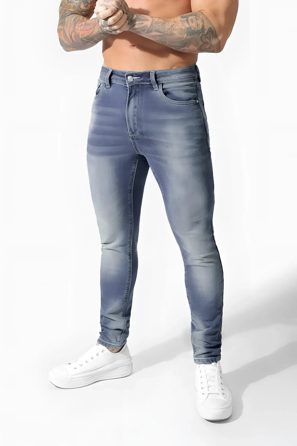 Men’s premium fitted stretchy jeans in faded blue denim with slim fit and subtle whiskering details