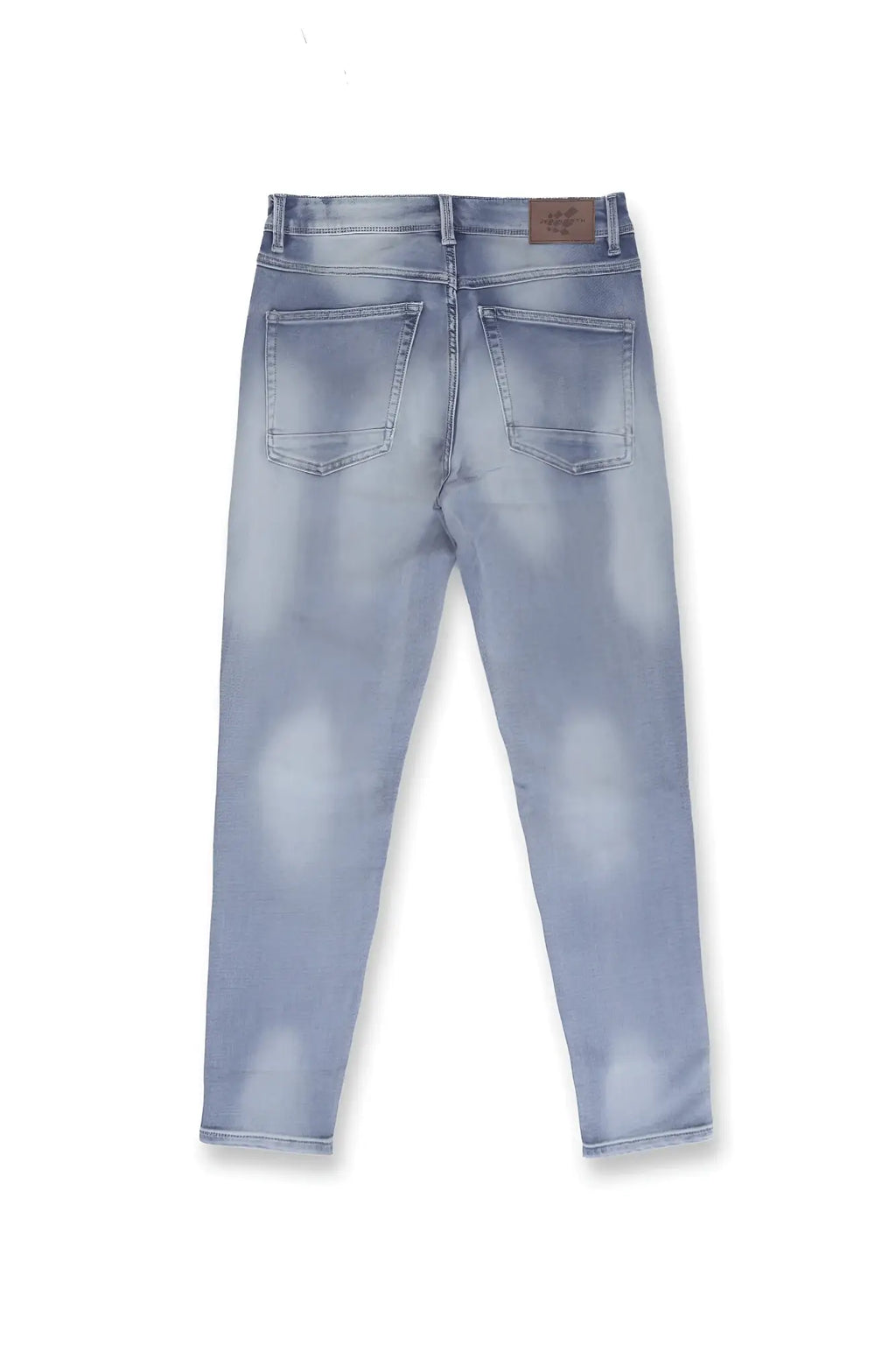Men’s premium fitted stretchy jeans in faded blue light-wash denim with a distressed and subtle fading pattern