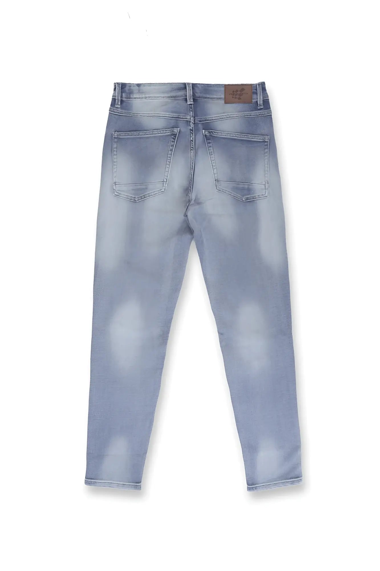 Men’s premium fitted stretchy jeans in faded blue light-wash denim with a distressed and subtle fading pattern