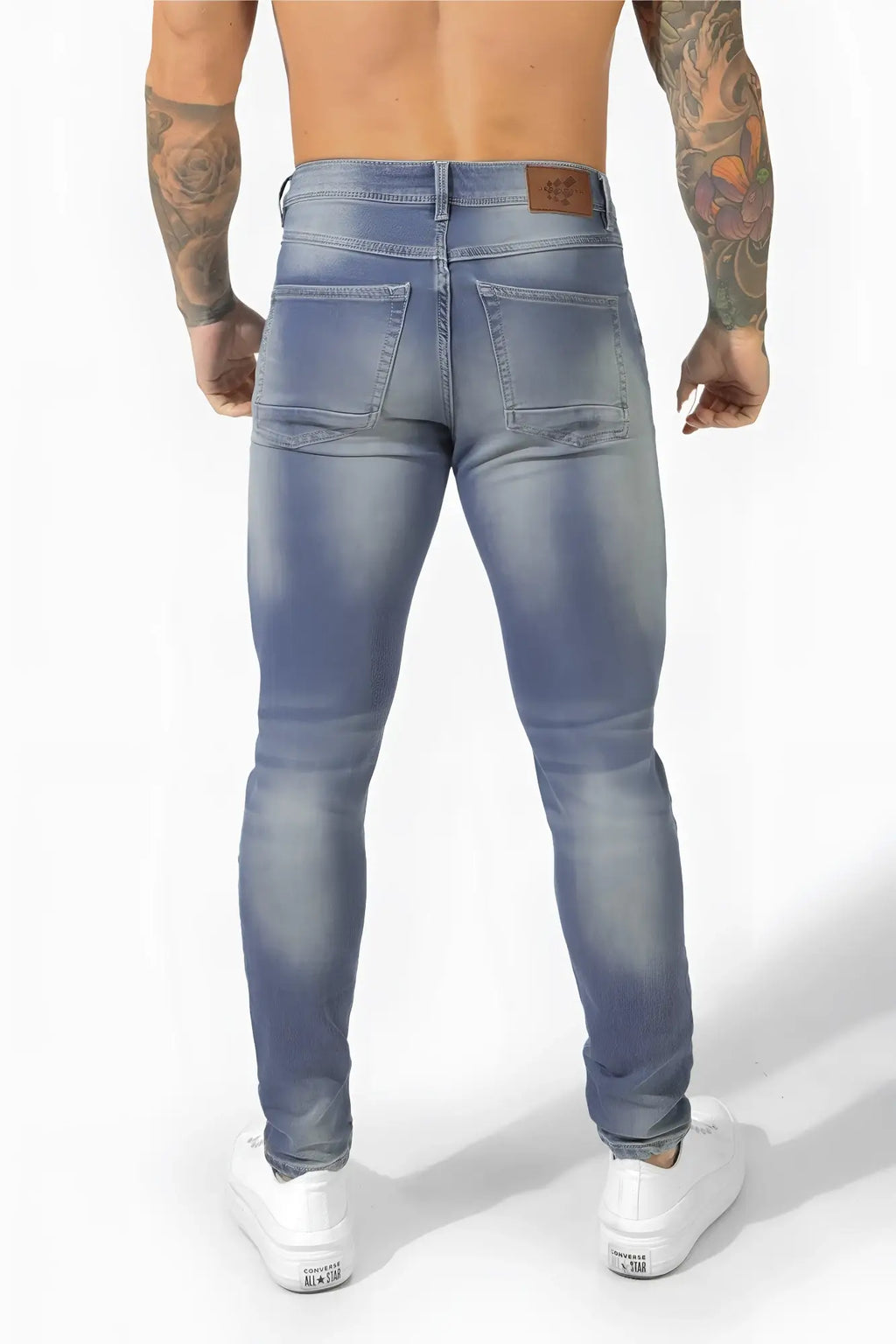 Men’s premium fitted stretchy light-wash denim jeans with slim fit and faded blue detailing