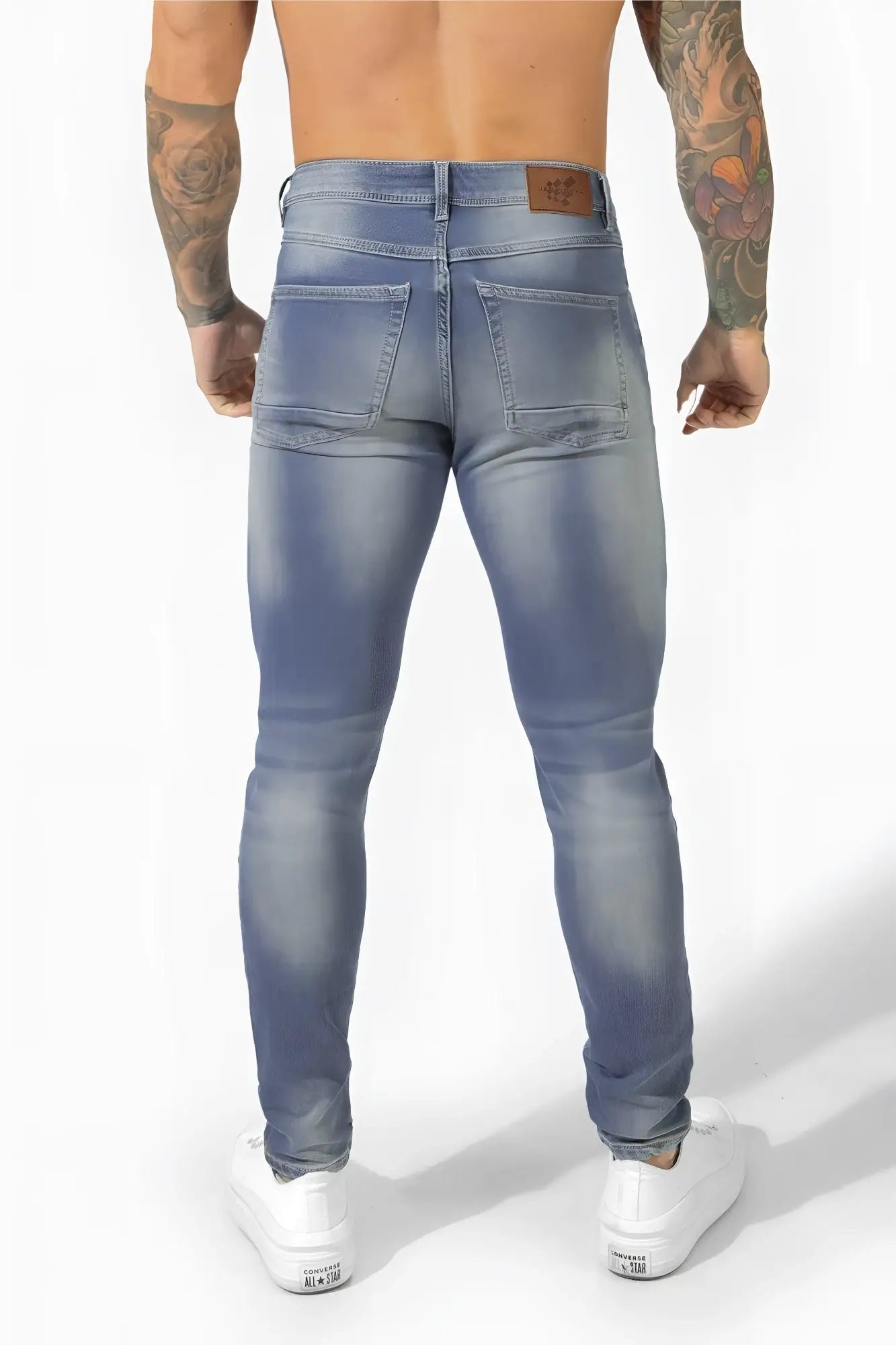 Men’s premium fitted stretchy light-wash denim jeans with slim fit and faded blue detailing