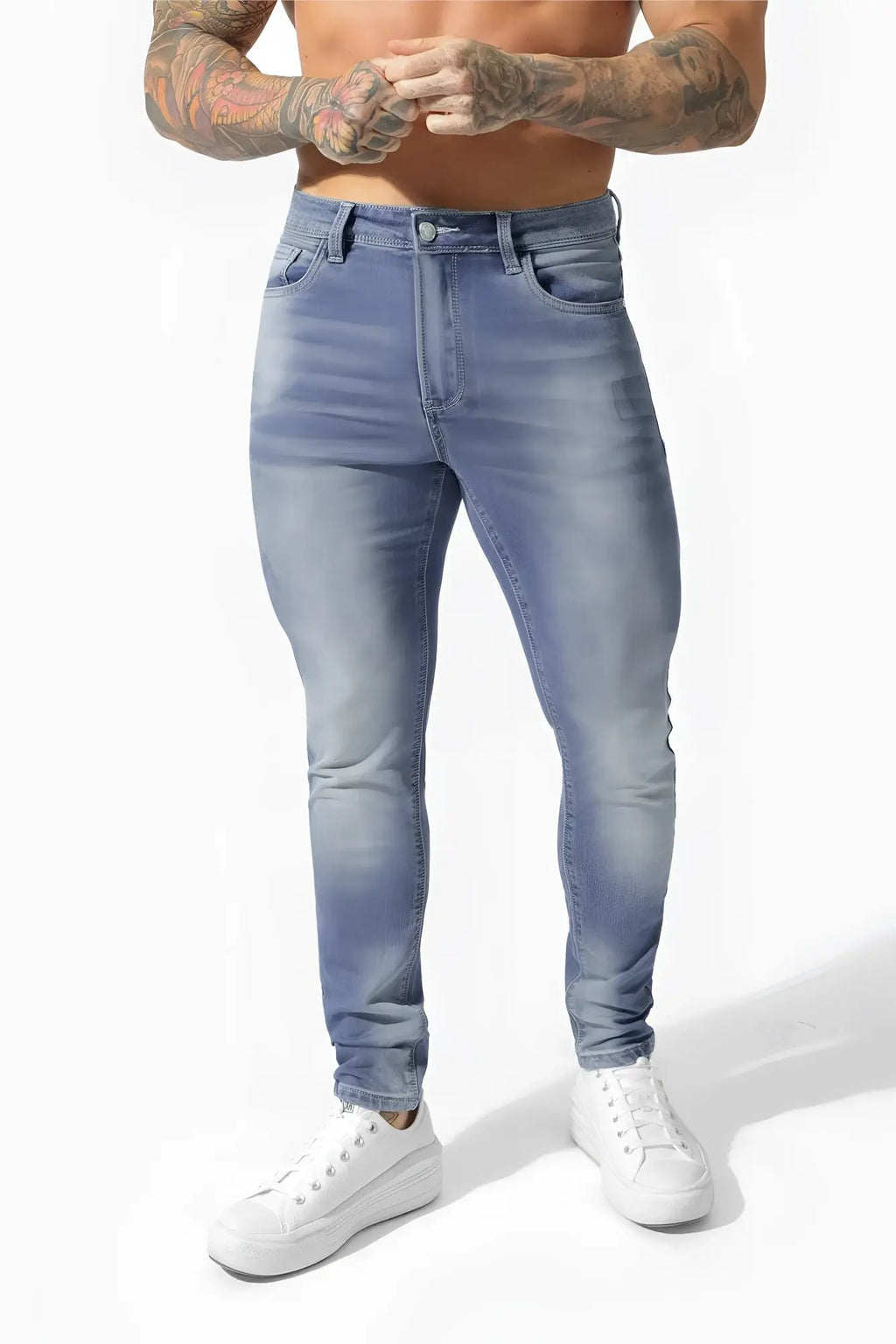 Men’s premium fitted stretchy jeans in faded blue light-wash denim with slim fit and classic five-pocket design