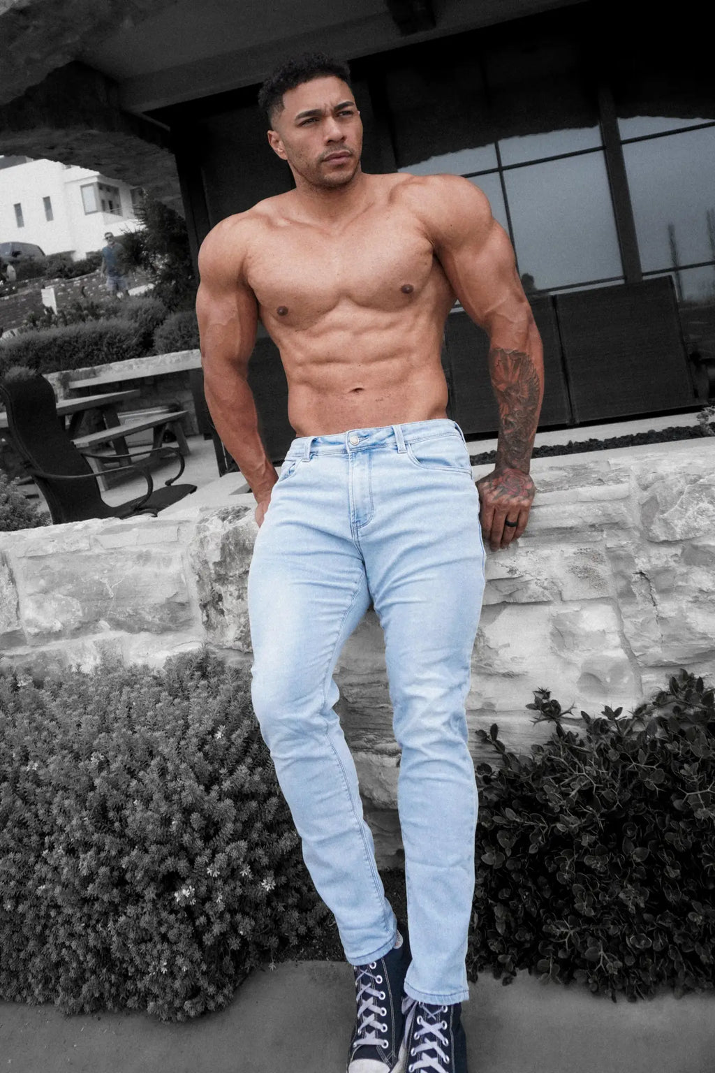 Men’s premium fitted stretchy light-wash denim jeans with classic five-pocket design and subtle thigh fading