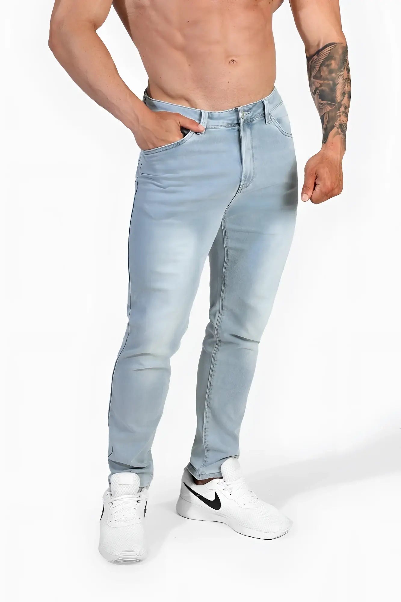 Men’s premium fitted stretchy jeans in faded light blue with slim-fit cut and subtle light-wash denim fading