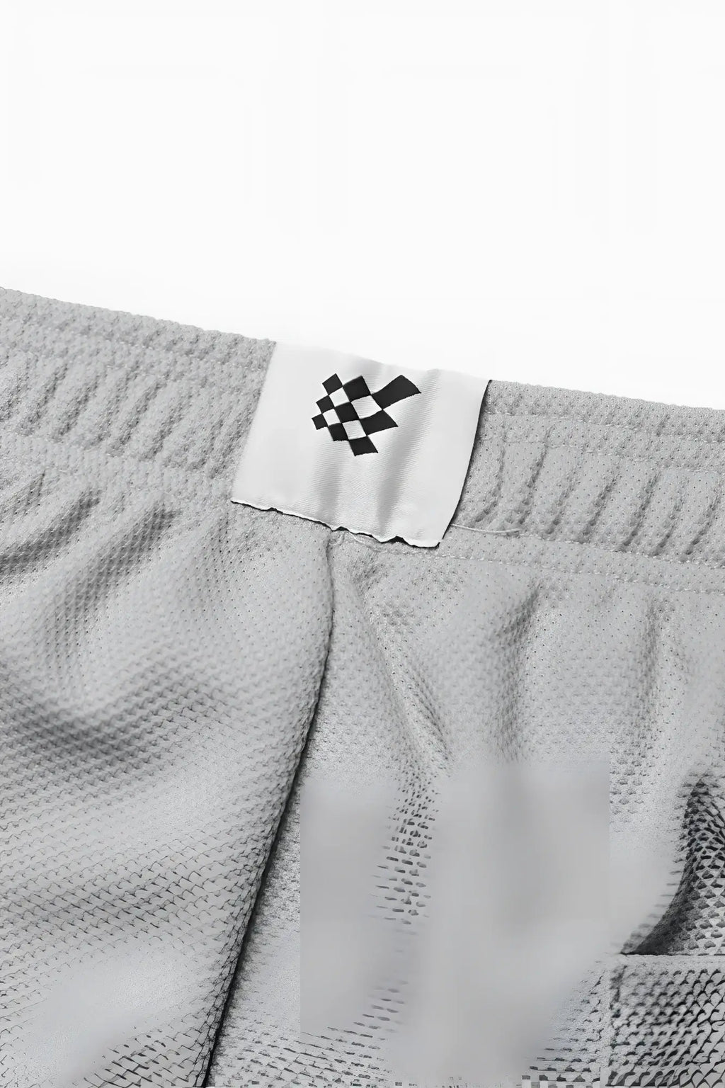 Men’s pro mesh shorts 8 inch light gray textured fabric with white label and black checkered logo front view