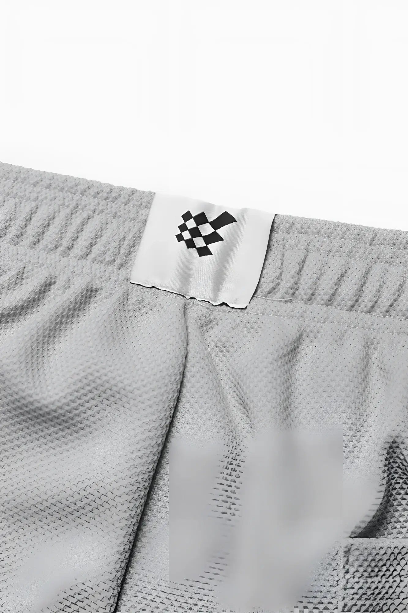 Men’s pro mesh shorts 8 inch light gray textured fabric with white label and black checkered logo front view